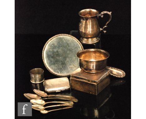 A parcel lot of assorted hallmarked silver items to include a tankard, five spoons, a cigarette case and box, a small bowl, n
