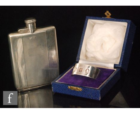 A hallmarked silver rectangular hip flask with engine turned decoration to whole below bayonet cap, length 12cm, Sheffield 19