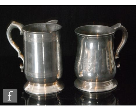 Two 18th Century pewter quart tankards, the first of baluster form with scroll handle and the second of footed cylindrical fo