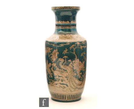 A Chinese green glazed rouleau vase, the emerald green glazed body with everted dish mouth rim, decorated with traditional sc