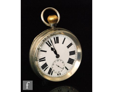 An LMS railway white metal crown wind open faced pocket watch, white enamelled dial with Roman numerals and subsidiary dial, 