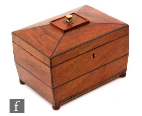 A small 19th Century mahogany and boxwood strung sarcophagus inlaid tea caddy, fitted with two divisions, the cover centred w