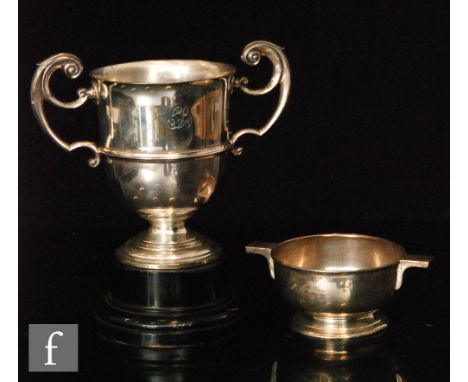 A hallmarked silver twin handled trophy of plain form, engraved with initials, weight 19.5oz, London 1913, R &amp; S Garrard 