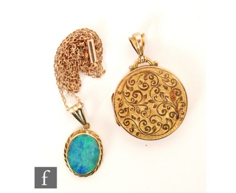 A 9ct hallmarked rose gold circular locket, weight 8g, Birmingham 1908, with a later opal doublet pendant suspended form a  f