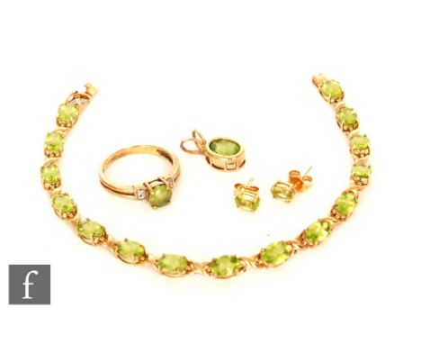 A modern suite of 9ct peridot jewellery to include bracelet, stud earrings, ring and pendant, total weight 12.5. (4). 