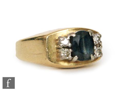 A mid 20th Century 18ct sapphire and diamond ring, central sapphire flanked with two diamonds to either side, weight 4.5g, ri