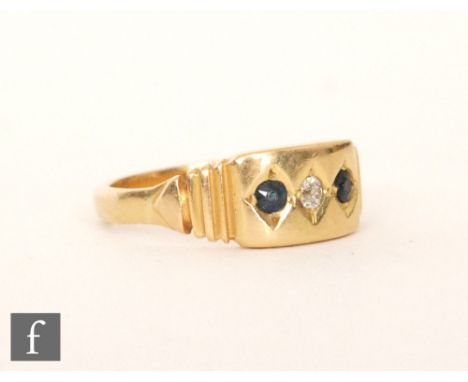 An early 20th Century 18ct sapphire and diamond three stone ring, central diamond flanked with sapphires, weight 3.5g, ring s