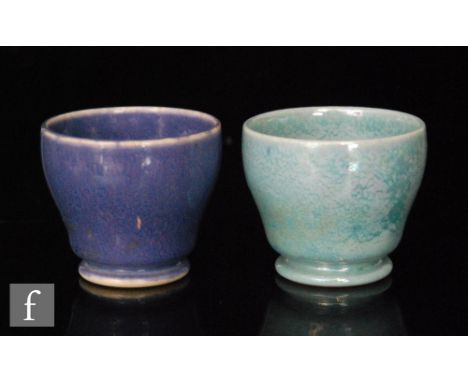 Two early 20th Century Ruskin Pottery miniature high sided footed bowls with lustre glazes, the first in duck egg blue and th