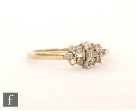 An 9ct hallmarked rectangular diamond cluster ring comprising of fifteen brilliant and baguette claw set stones, ring size Q.