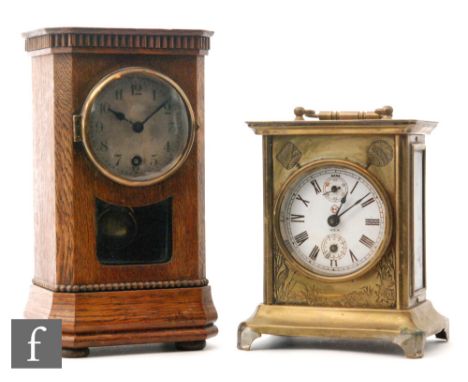 An early 20th Century brass cased American alarm clock in Japanned decorated case and a small oak similar mantle clock (2)