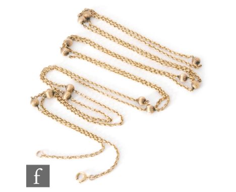 An 14ct guard belcher link guard chain detailed with thirteen ribbed ball spacers, terminating in bolt ring fastener, length 
