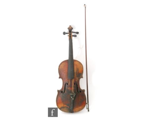 A late 19th Century violin, with a spruce soundboard and maple back, bearing a spurious paper label 'Antonius Stradiuarius Cr