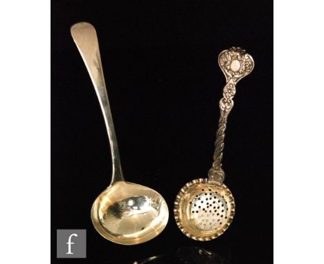 A Victorian hallmarked silver shifting spoon crimped circular bowl below spiral and foliate detailed handle, length 15cm, Lon