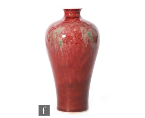 A Chinese 'Peach Bloom' glazed meiping vase of typical shouldered form with short everted rim, red glaze with blushing green 