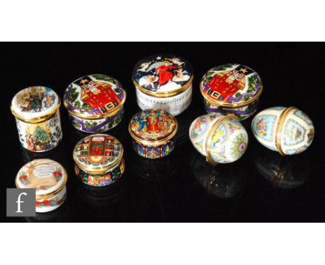 A collection of seasonal enamels to include pill or patch boxes, Easter eggs and music boxes including Halycon Days Christmas