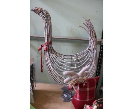 A large metal &amp; wood model goose, and a material doorstop
