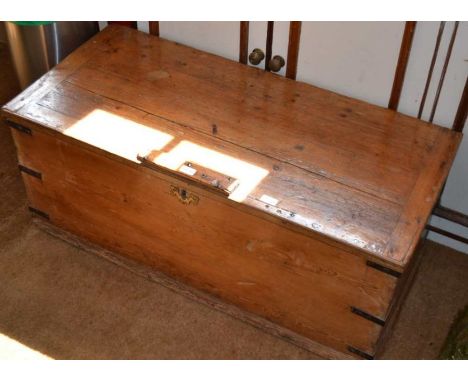 A 19th century pine trunk with steel bands, 110cm wide&nbsp;