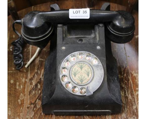A vintage Bakelite dial telephone, model 164 TE 45/1