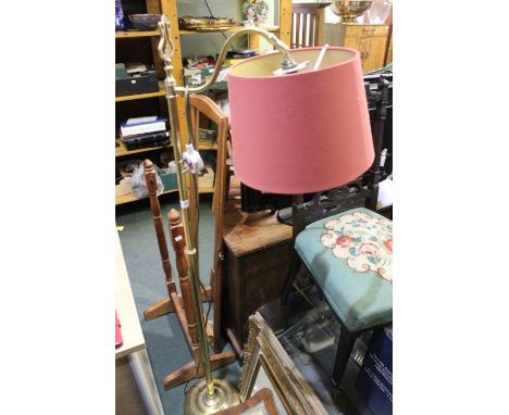 A standard brass lamp with shade.