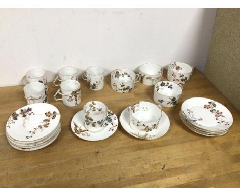 A coffee set, possibly French, including six demi tasse cups (6cm), with foliate and gilt decoration, the handles of faux bra