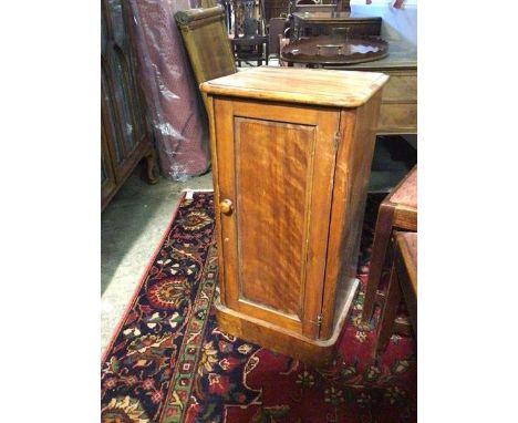 A Victorian satin birch bedside cabinet, the moulded top above a single panel door with shelf to interior, on plinth base (a/