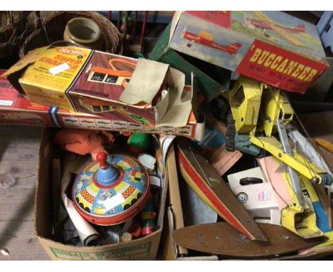 A collection of vintage toys including a Buccaneer Ready to Fly model of a plane, metal digger, vintage spinning top, hotwhee