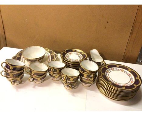 An Aynsley teaset including twelve cups, six saucers, six side plates, milk jug, sugar bowl and serving plate, all with gilt 