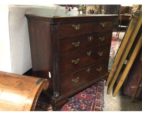 A late George III mahogany chest of drawers, the rectangular top with moulded edge above two short drawers and three long dra