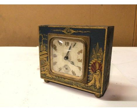 A 1940s/50s Japanese style table clock, inscribed Made in France (9cm x 10cm x 5cm)
