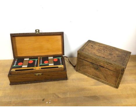 A 19thc walnut veneered small tea caddy, with inlaid border to top, lacking liners to interior (10cm x 18cm x 11cm) and a mid