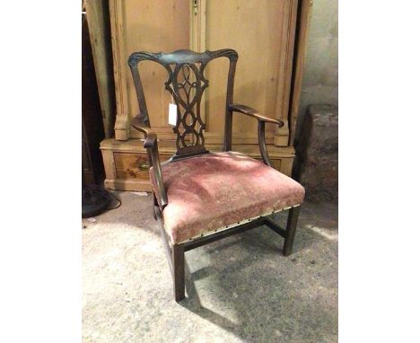 A George III mahogany Chippendale style open armchair, the moulded top rail above an intricately pierced splat, curved arms w