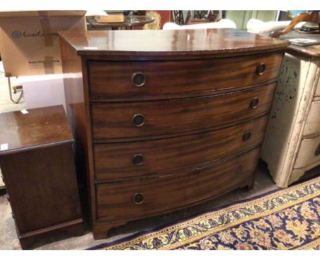 An early 19thc bow front mahogany chest, fitted four graduated drawers, ring handles, on shaped bracket feet (100cm x 116cm x