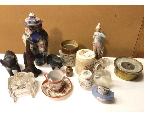 A mixed lot including carved wooden animal figures, Chinese teacup and saucer, a Continental figure of an 18thc Gentleman, gl