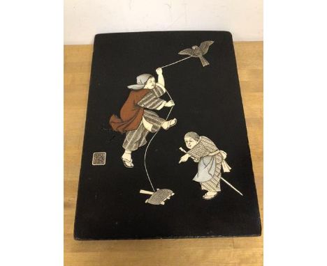 A Japanese black lacquer panel, c.1900, with mother of pearl, wood and ivory figures and bird, seal mark (30cm x 22cm)