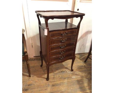 A reproduction Edwardian style sheet music cabinet, with upper tier, the top with raised undulating edge on shaped supports a