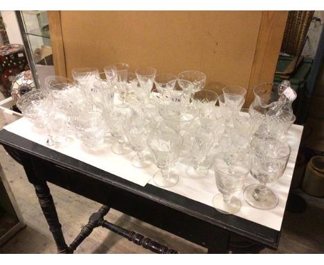 A large quantity of glassware including cut glass wine glasses, sherry glasses, fruit bowls, whisky glasses, jug, decanter, c