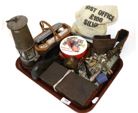 A quantity of collectors items including a miners lamp, two gun shot flasks, a corkscrew, wooden box scales, silver teaspoons