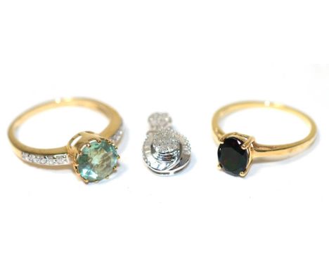 A 9 carat gold fluorite and white zircon ring, a round cut fluorite in a claw setting, to ziron set shoulders, finger size S;