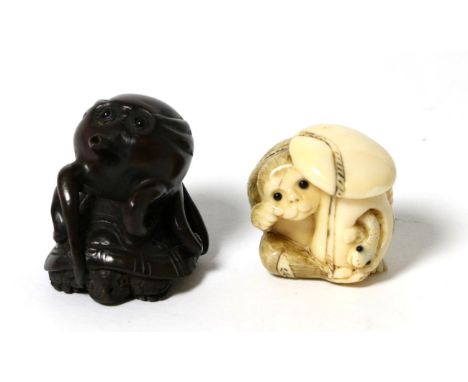 A late 19th century Japanese netsuke signed and a netsuke modelled as an octopus on a turtles back, signed (2) 