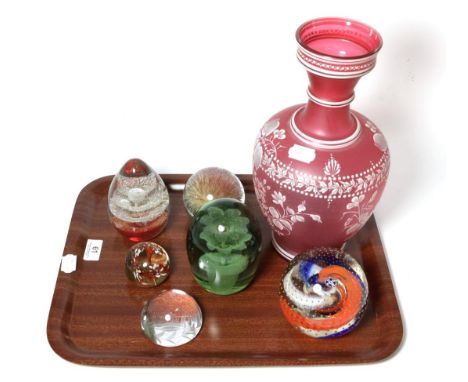 A Victorian dump glass paperweight, Caithness millennium paperweight, four other paperweights and a glass vase 