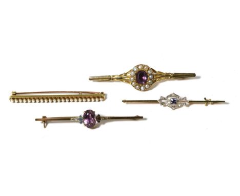 A purple paste and seed pearl brooch, an oval purple paste in a border of seed pearls, to a bell husk bar, 6cm long; a sapphi