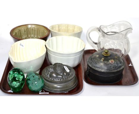 A 19th century tole ware circular spice box, pewter and ceramic jelly moulds, two dump paperweights etc