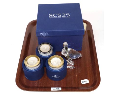A Swarovski bird and three tea light holders (4) 