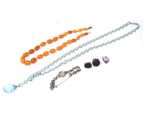 A copal bead necklace, graduated barrel copal beads, knotted to a metal clasp, length 45cm; a pair of Wedgwood black of basal