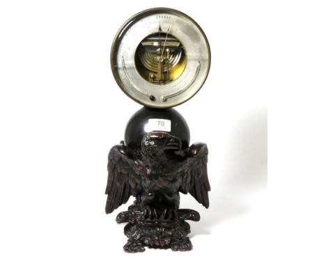 A patinated barometer/thermometer, circa 1860, inscribed verso 'Presented By The Right Hon. the Earl of Aberdeen To John Corm