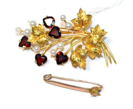 A garnet and cultured pearl spray brooch, heart cut garents in claw settings and cultured pearls to a textured leaf spray, me