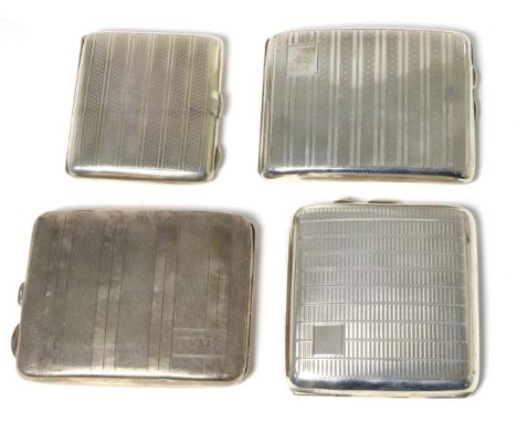 Four engine turned silver cigarette cases, the largest 10cm wide, 13.8ozt