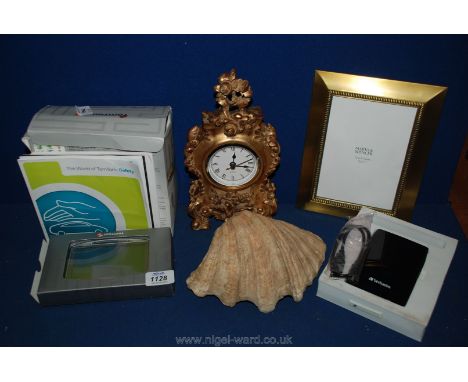 A quantity of miscellanea including a Verbatim external hard drive, Tom Tom (boxed), quartz mantle clock, picture frame, shel