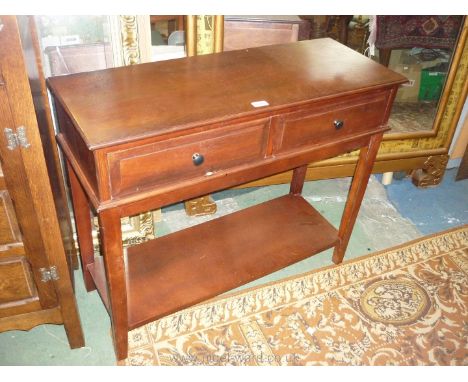 A Mahogany finished hall Side Table having two frieze drawers and lower shelf, 35 1/4'' wide x 28 1/2'' high x 13 1/2'' deep.