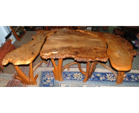 A rustic Wych Elm nest of Tables/table and benches, assembling to form an abstract shape and featuring most attractive burr d